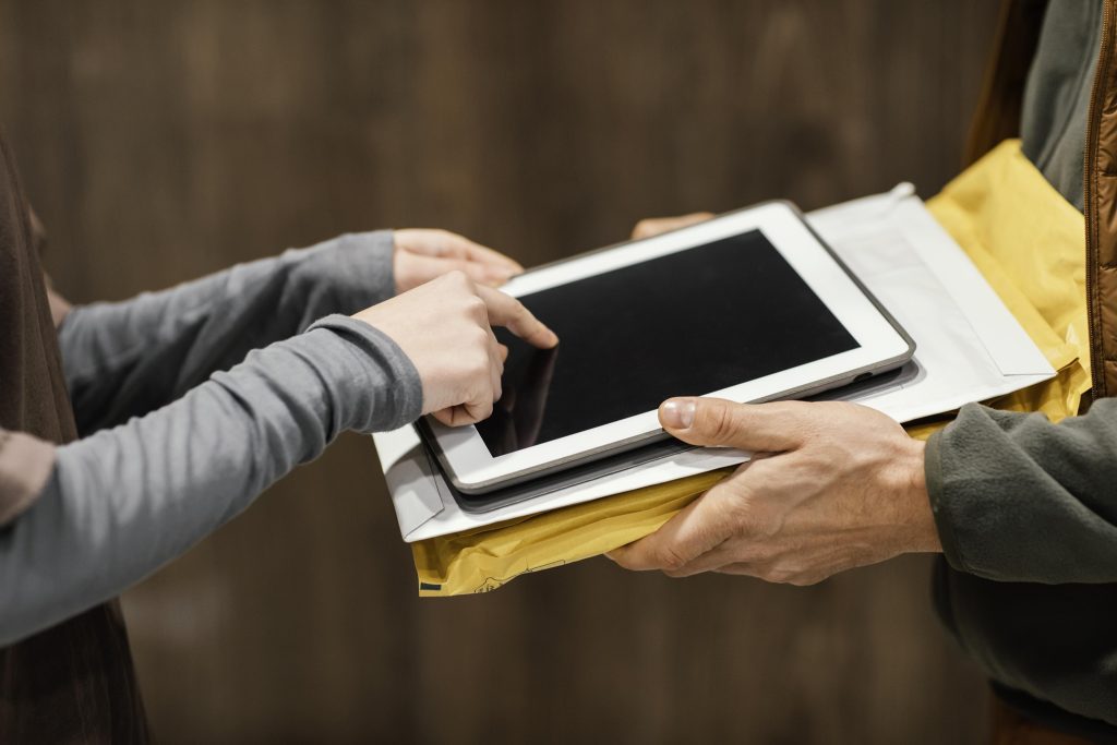close up tablet electronic signature delivery